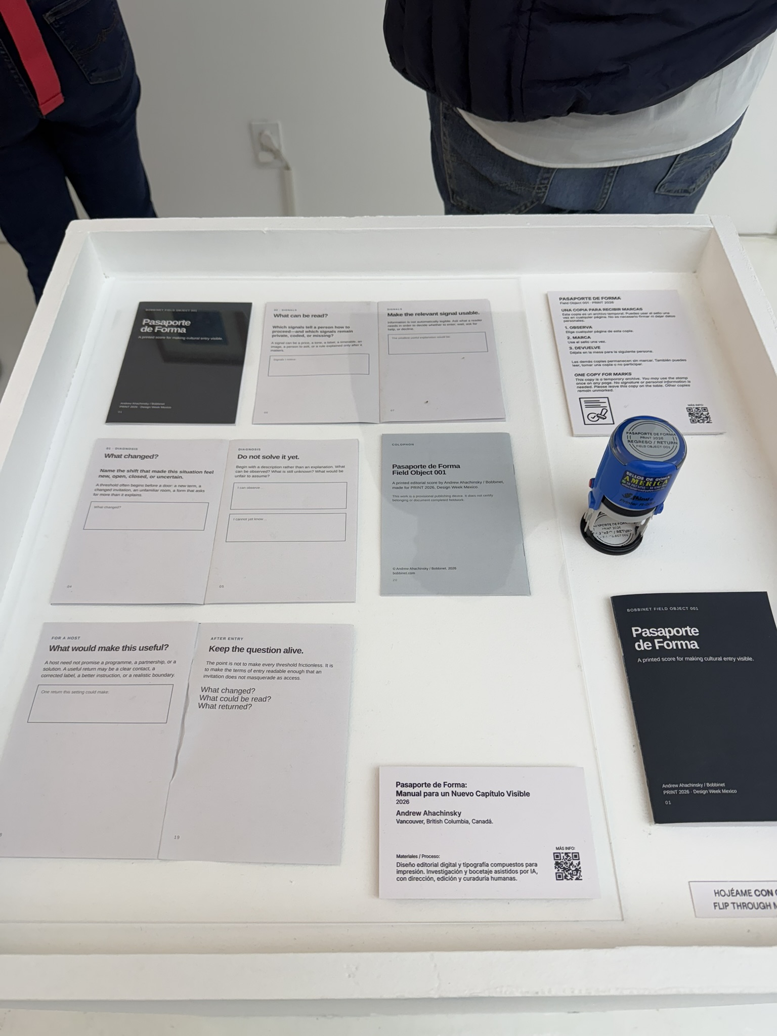 Passport on the table at PRINT 2026, photographed by Miguel Alpuche.